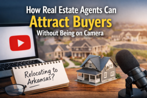 Modern home office desk with laptop showing YouTube, microphone, and model home representing educational real estate videos that attract buyers without being on camera