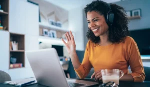Realtor working on YouTube marketing strategy on a laptop in a home office workspace